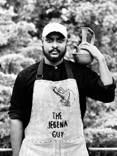 Ethiopian coffee farmers working with coffee cherries